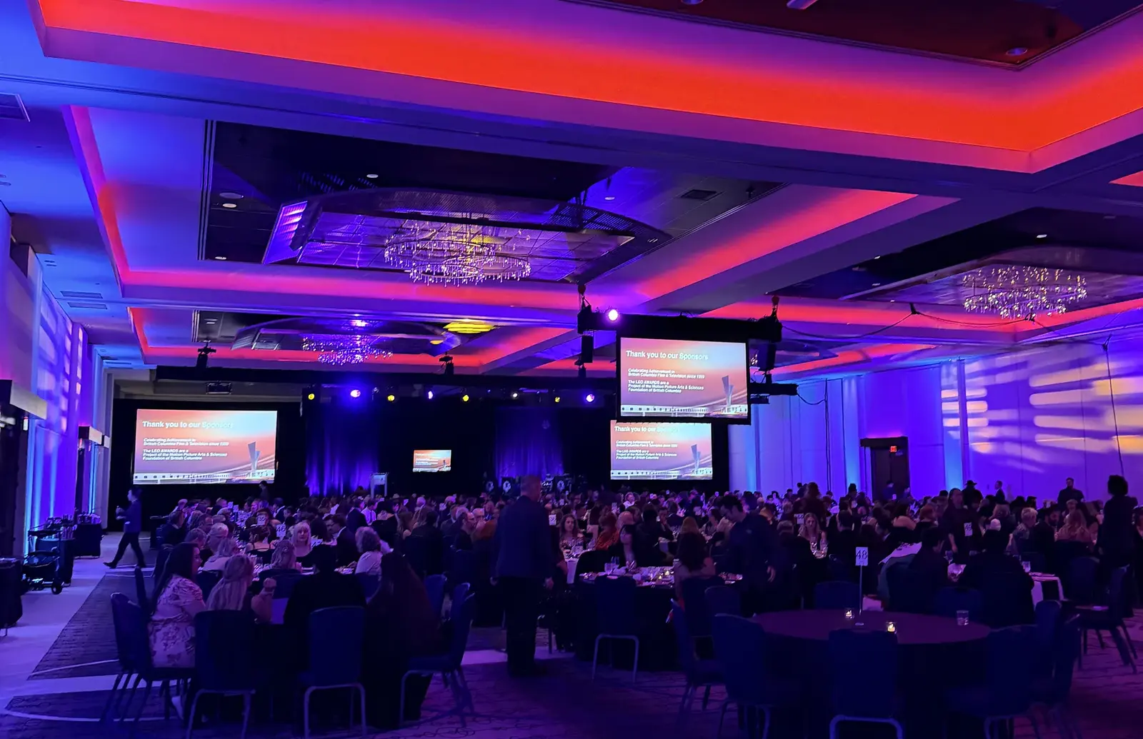 Ballroom at the 2026 BC Leo Awards with pink and blue stage lighting