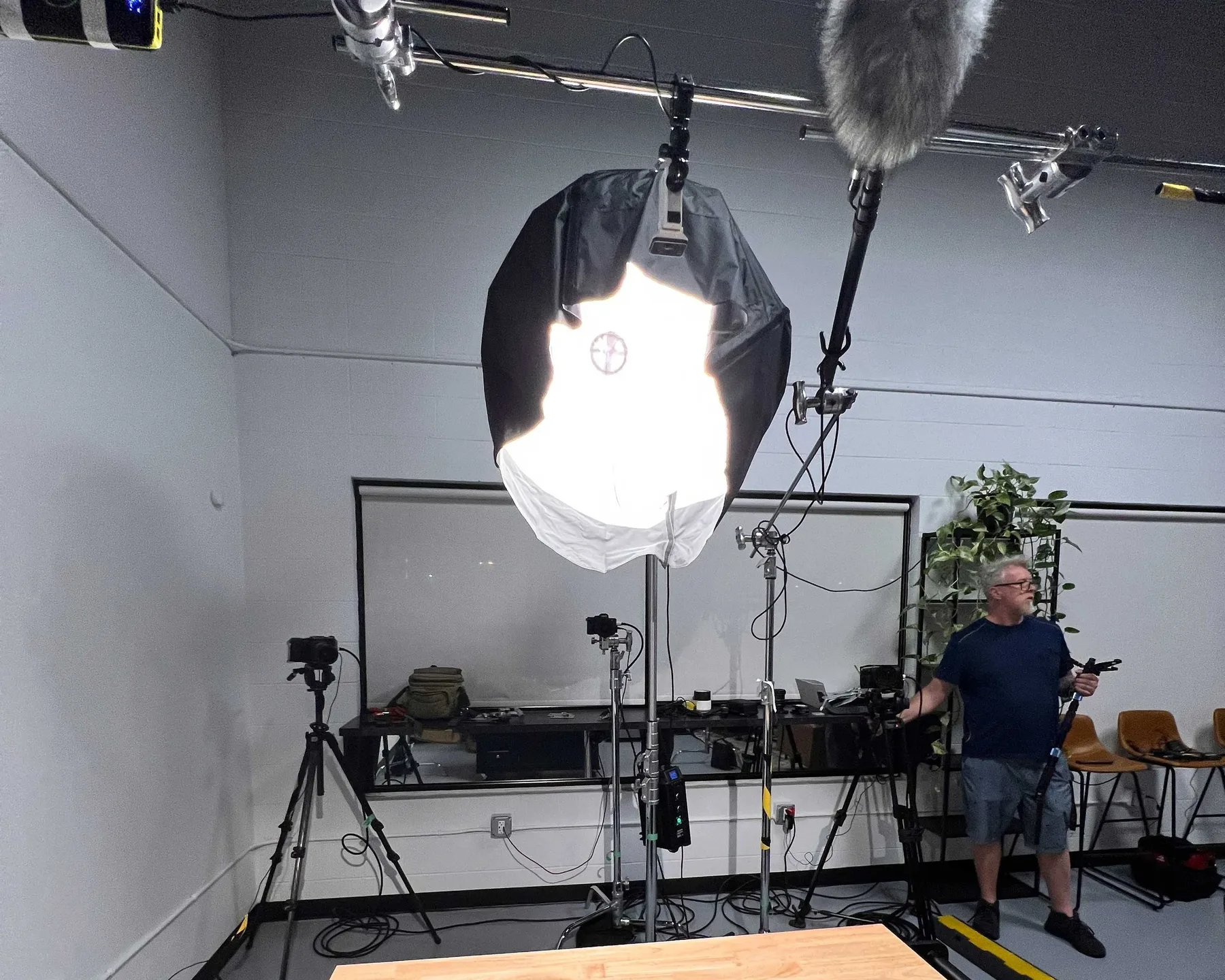Lighting and audio equipment surrounding a working KFS production set