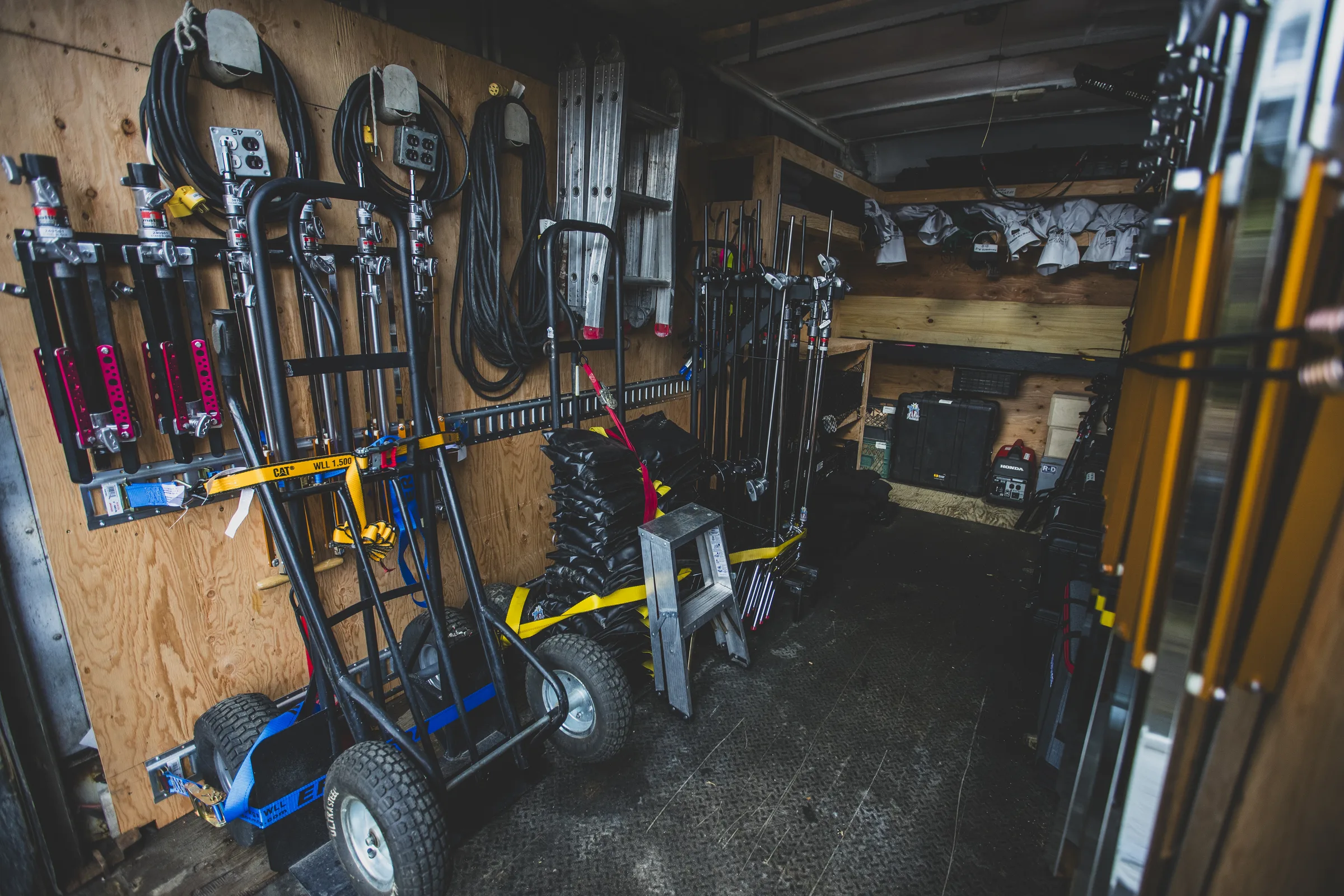 Grip and electric truck interior with production cable, stands and support equipment