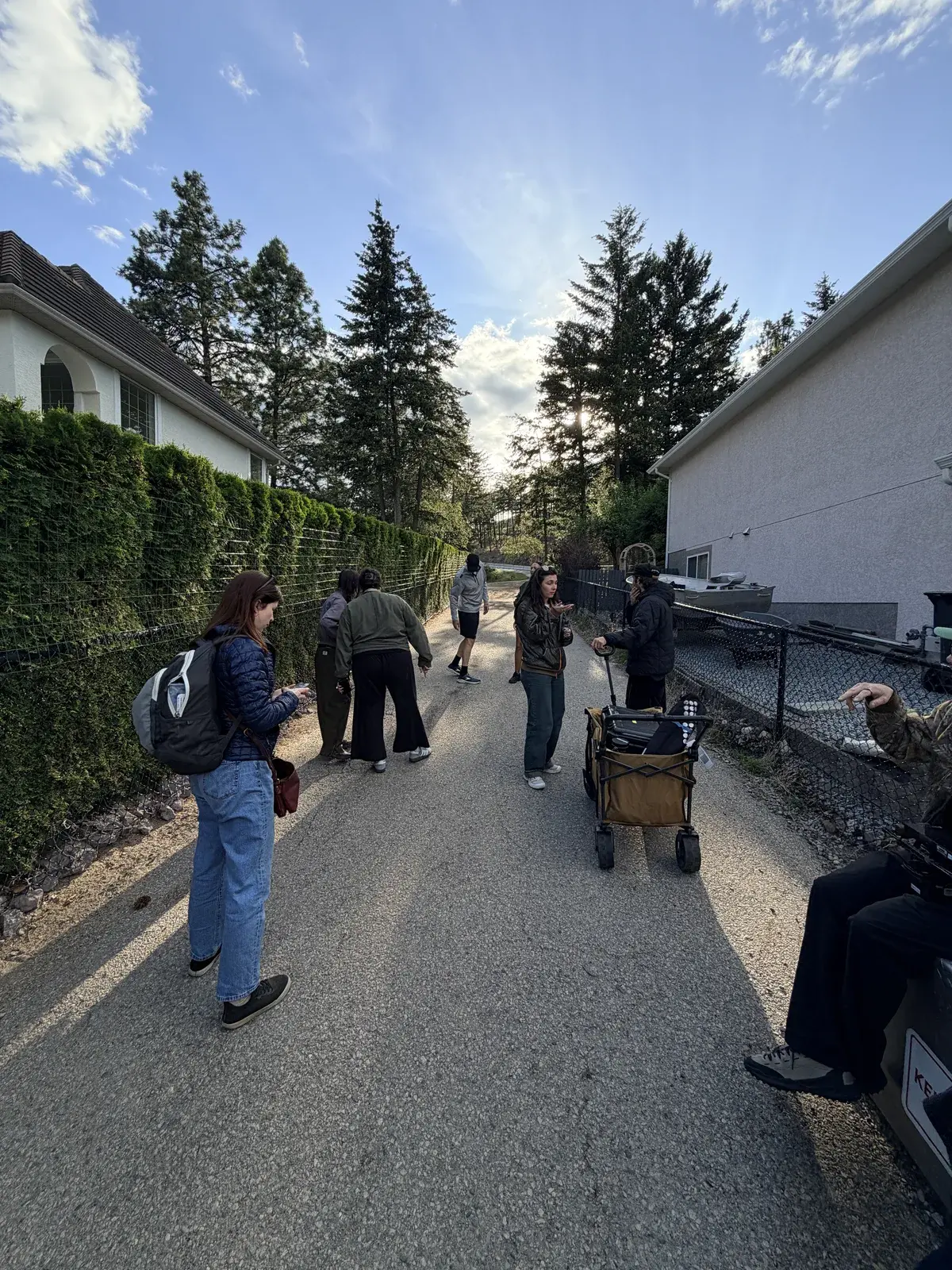 Production crew walking through a residential location during the Airbnb host stories campaign