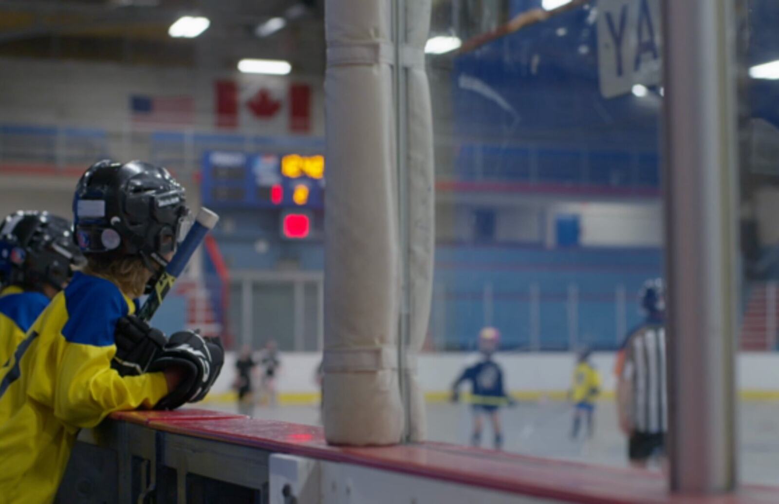Young ball hockey players filmed from the bench during a Kelowna broadcast campaign