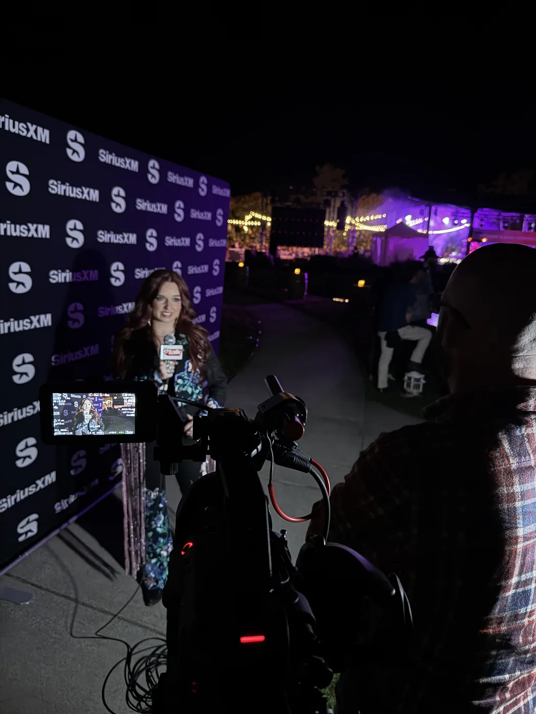 Camera setup for eTalk near a SiriusXM backdrop in Kelowna