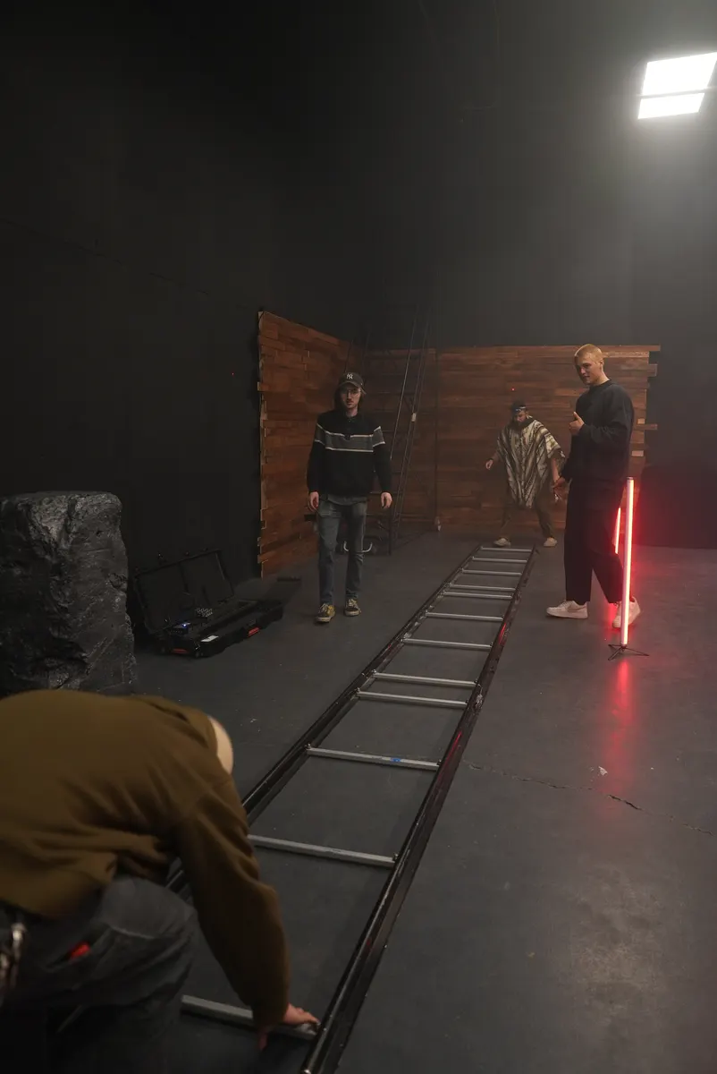 Dolly track and actors inside The Keepers studio set