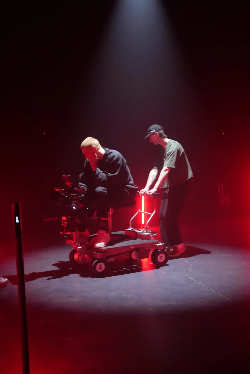 Camera team working on a red-lit dolly shot for The Keepers inside the former KFS stage