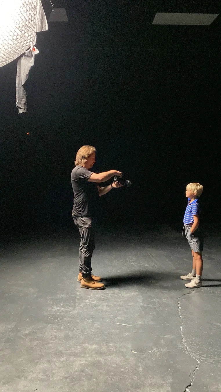 James Alton directing young Dave in a black studio setup for Three Hearts