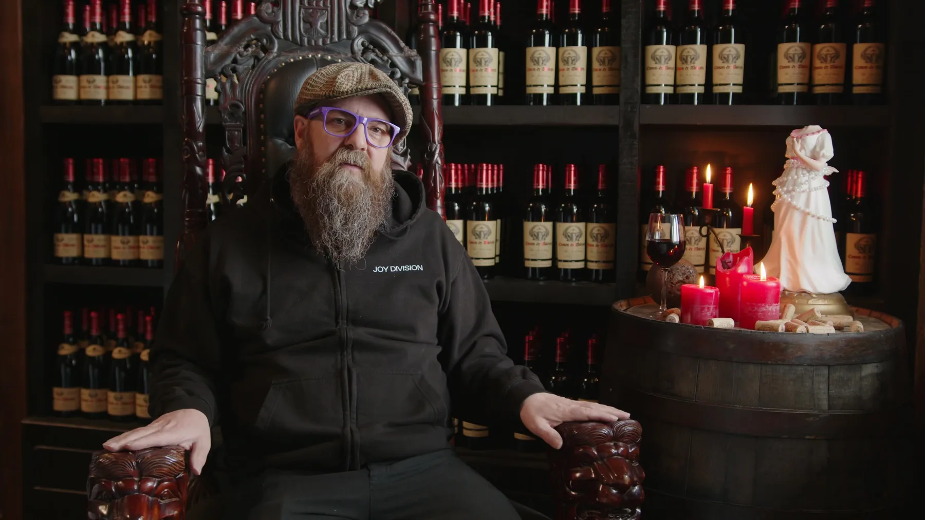 Jason Parkes seated in a wine room interview setup for Vintage Rebel